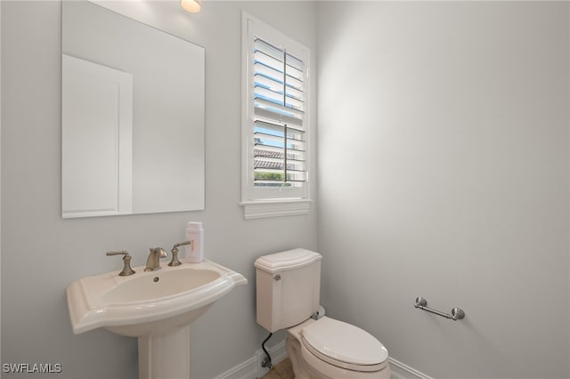 bathroom with sink and toilet