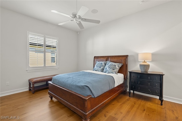 bedroom with hardwood / wood-style flooring and ceiling fan