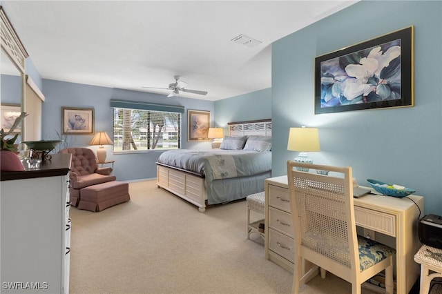 bedroom featuring ceiling fan and light carpet