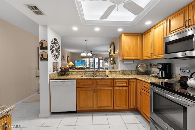 kitchen featuring pendant lighting, appliances with stainless steel finishes, sink, kitchen peninsula, and light tile patterned floors