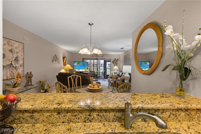 dining space with a chandelier