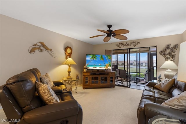 living room with ceiling fan and carpet floors