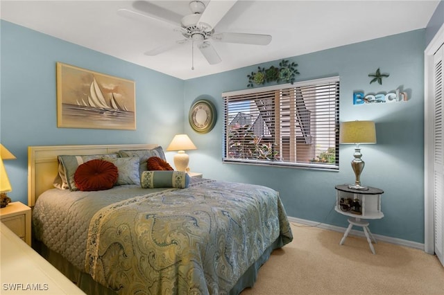 bedroom with carpet flooring, a closet, and ceiling fan