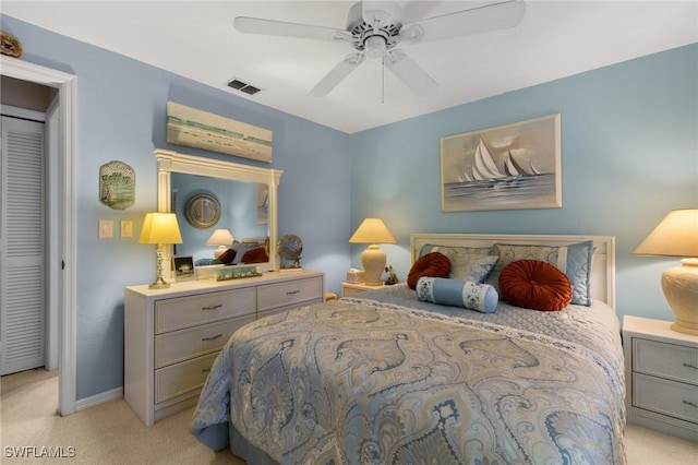 carpeted bedroom with ceiling fan