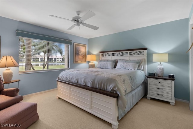 bedroom with light carpet and ceiling fan