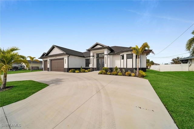 view of front facade with a front lawn and a garage