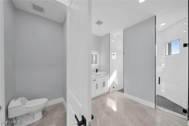 bathroom with toilet, vanity, and a tile shower