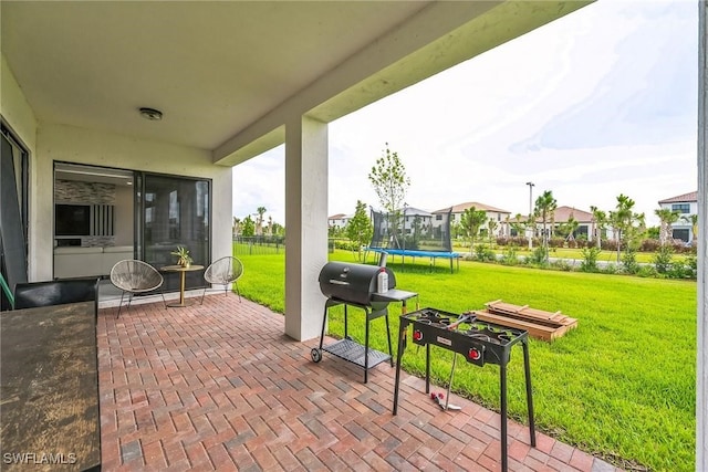 view of patio featuring a grill and a trampoline