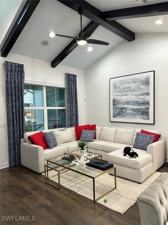 living room with ceiling fan, dark hardwood / wood-style floors, and lofted ceiling with beams