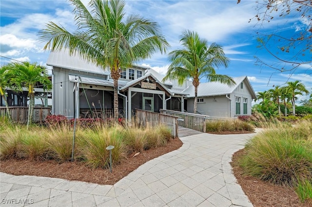 view of front of property featuring a sunroom