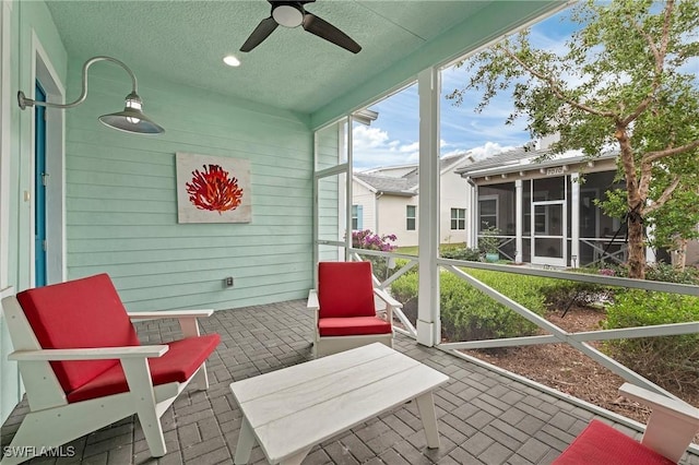 sunroom / solarium with ceiling fan