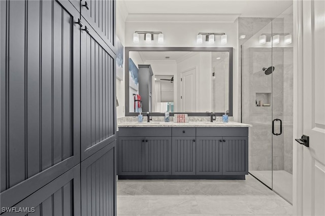 bathroom featuring vanity, an enclosed shower, and ornamental molding