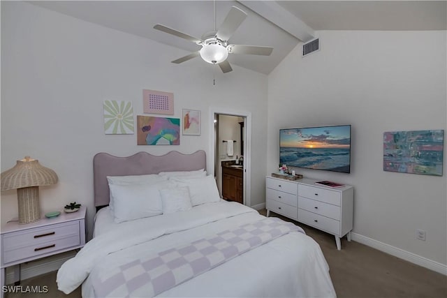 carpeted bedroom featuring ceiling fan, connected bathroom, and lofted ceiling with beams