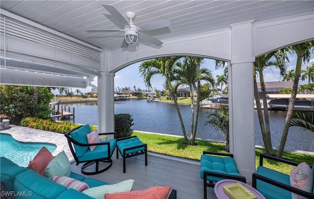 view of patio featuring an outdoor hangout area, ceiling fan, and a water view