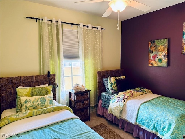 bedroom with ceiling fan and carpet floors