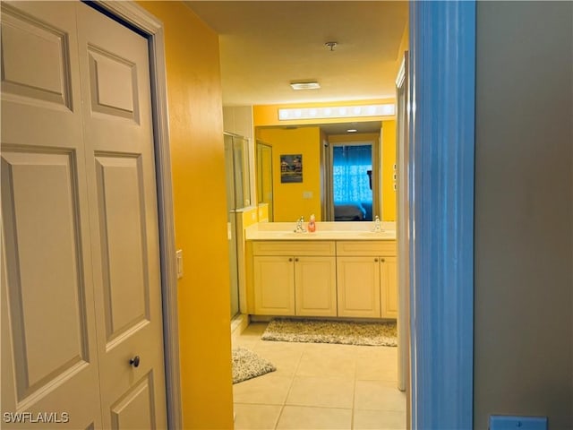 bathroom with vanity and tile patterned floors