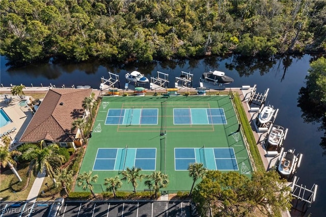 birds eye view of property with a water view