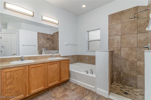 bathroom featuring separate shower and tub and vanity