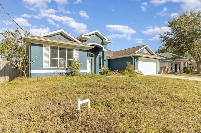 single story home featuring a garage and a front yard