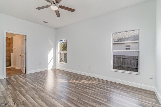 spare room featuring ceiling fan and hardwood / wood-style floors