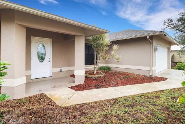 property entrance with a garage