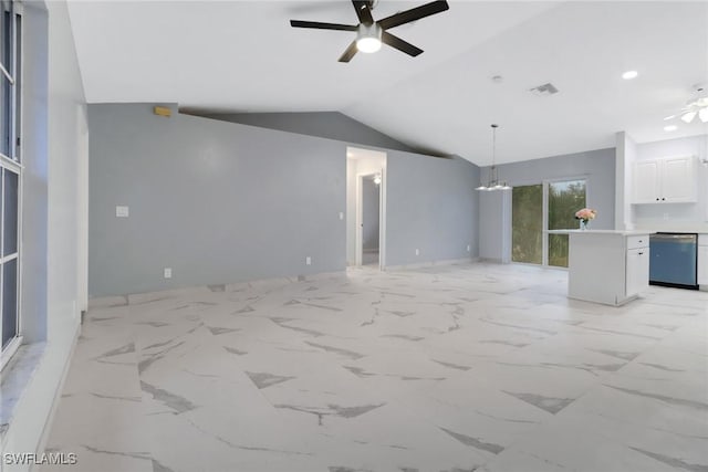 unfurnished living room with lofted ceiling and ceiling fan with notable chandelier