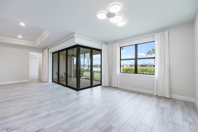 empty room featuring recessed lighting, light wood-style flooring, and baseboards