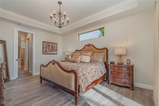 bedroom with crown molding, a chandelier, light wood-style floors, baseboards, and visible vents