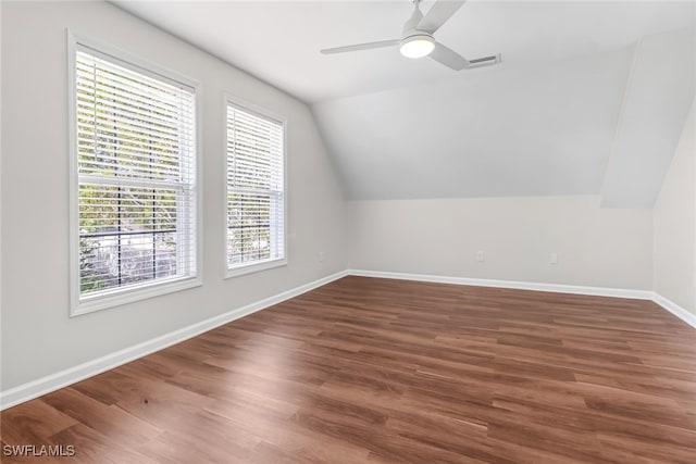 bonus room with lofted ceiling, ceiling fan, wood finished floors, and baseboards