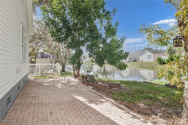 view of patio / terrace with a water view