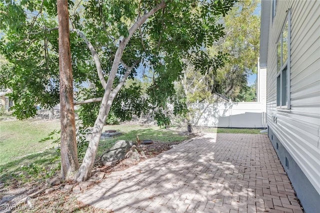 view of patio featuring fence