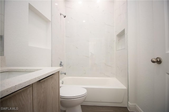 full bathroom with toilet, shower / bathtub combination, hardwood / wood-style floors, and vanity