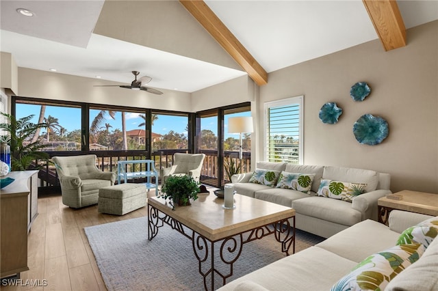 living room featuring high vaulted ceiling, ceiling fan, beamed ceiling, and light hardwood / wood-style floors