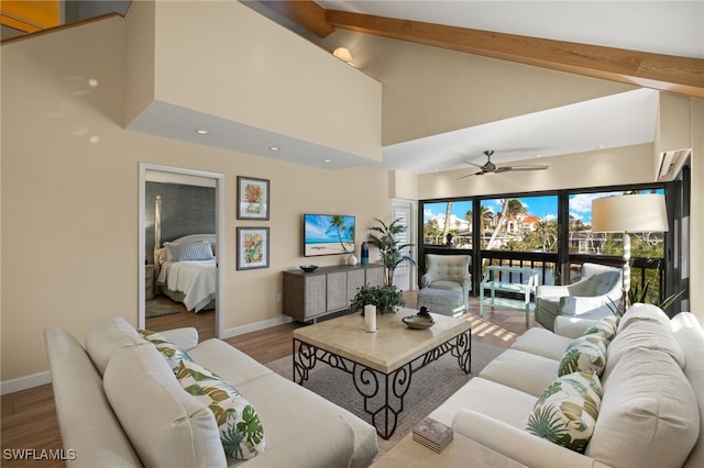 living room featuring ceiling fan, wood-type flooring, high vaulted ceiling, and beamed ceiling