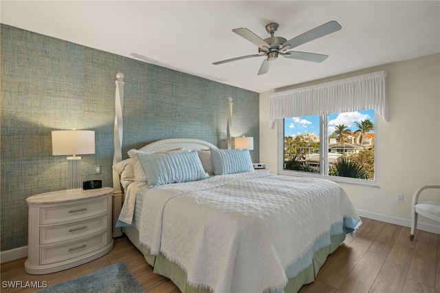 bedroom featuring ceiling fan and hardwood / wood-style flooring