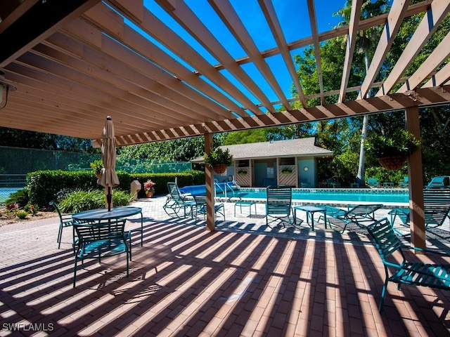 view of patio / terrace with a pergola and a community pool