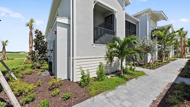 view of property exterior with a balcony