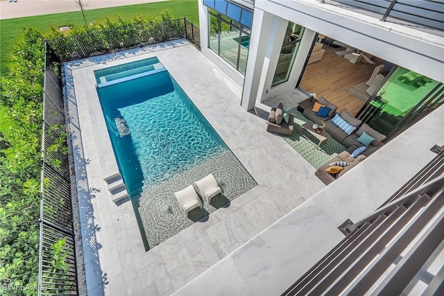 view of pool with an in ground hot tub and a patio area