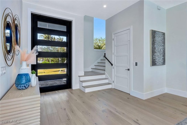 foyer entrance with light hardwood / wood-style flooring