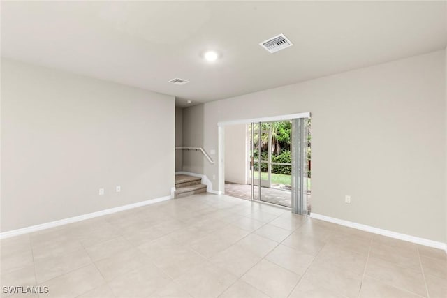 unfurnished room featuring light tile patterned flooring