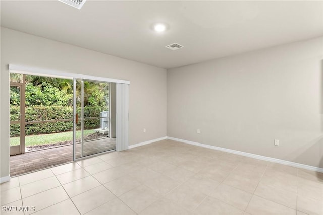 unfurnished room with light tile patterned floors