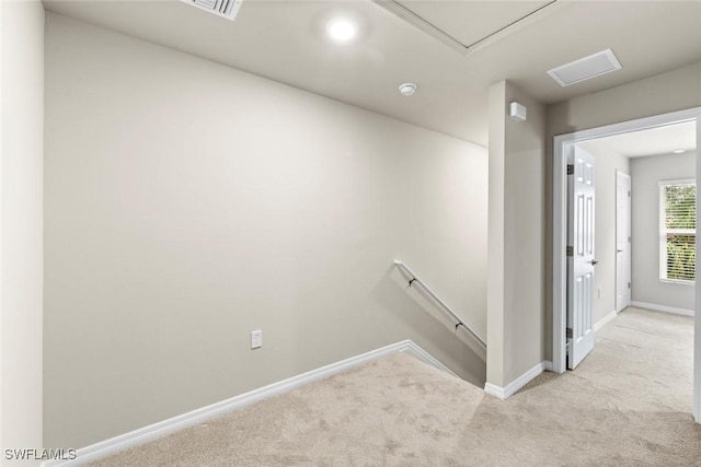 staircase featuring carpet flooring