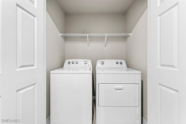 clothes washing area featuring washing machine and dryer