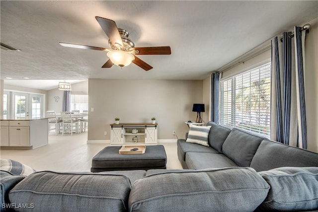 living room with ceiling fan