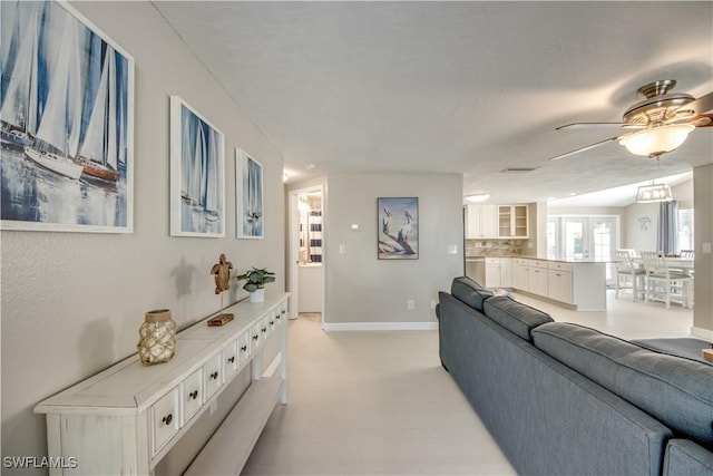 living room featuring ceiling fan