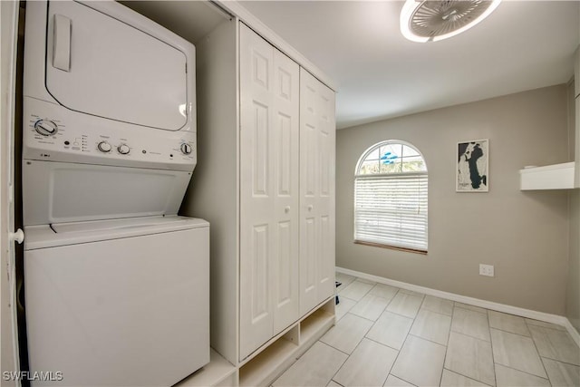 laundry area featuring stacked washer and dryer