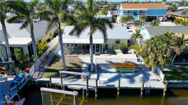 view of dock featuring a water view and a patio