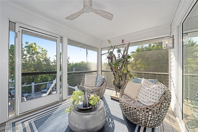 sunroom with ceiling fan and a healthy amount of sunlight