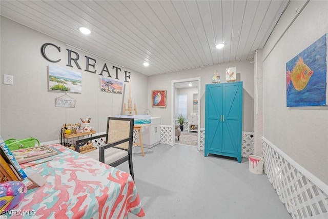 bedroom featuring wood ceiling and concrete flooring