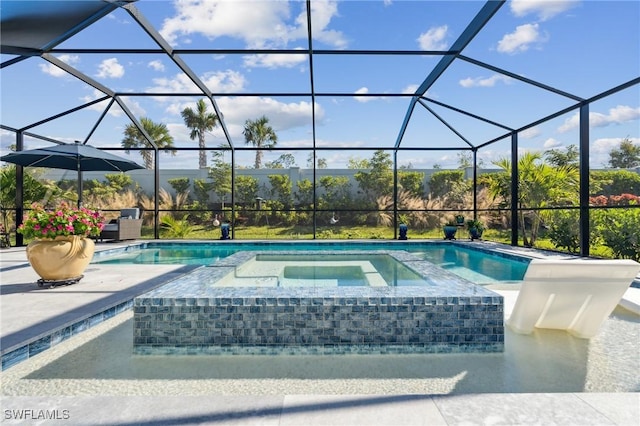 view of pool featuring an in ground hot tub, glass enclosure, and a patio